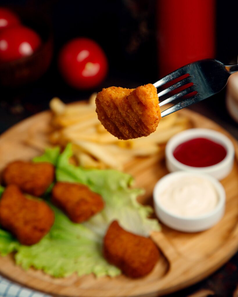 Crispy homemade chicken nuggets served with dipping sauces