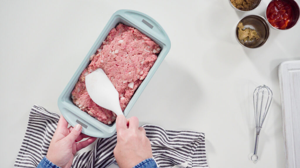 Shaping an Italian meatloaf before baking