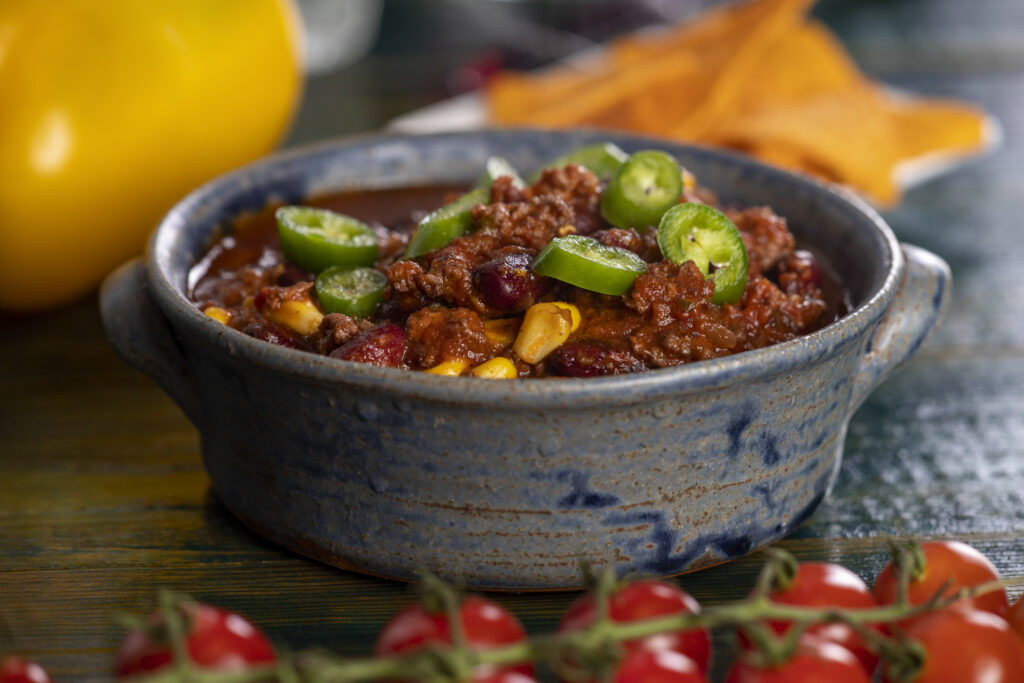 A bowl of vegetarian cowboy chili made with beans and vegetables.