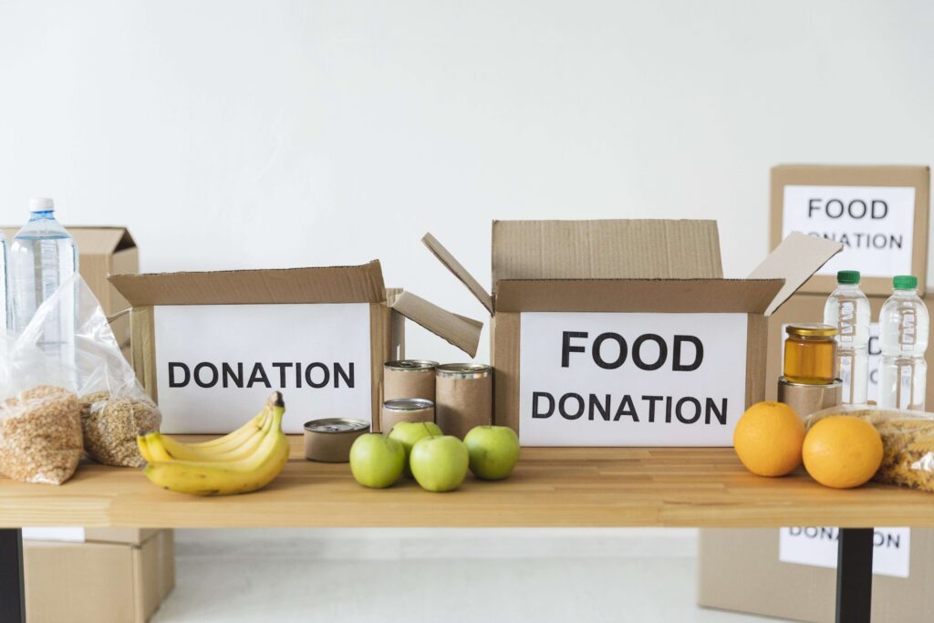 A food donation box with packaged meals and fresh produce at Costco