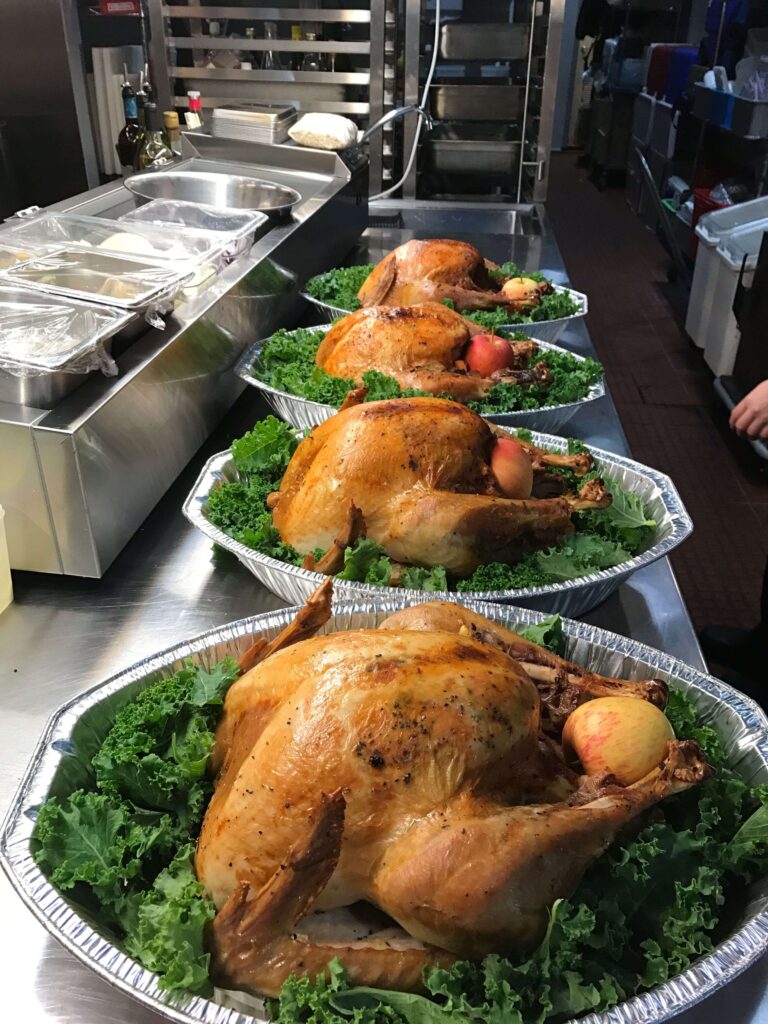 Rotisserie chickens displayed in a heated case at Costco