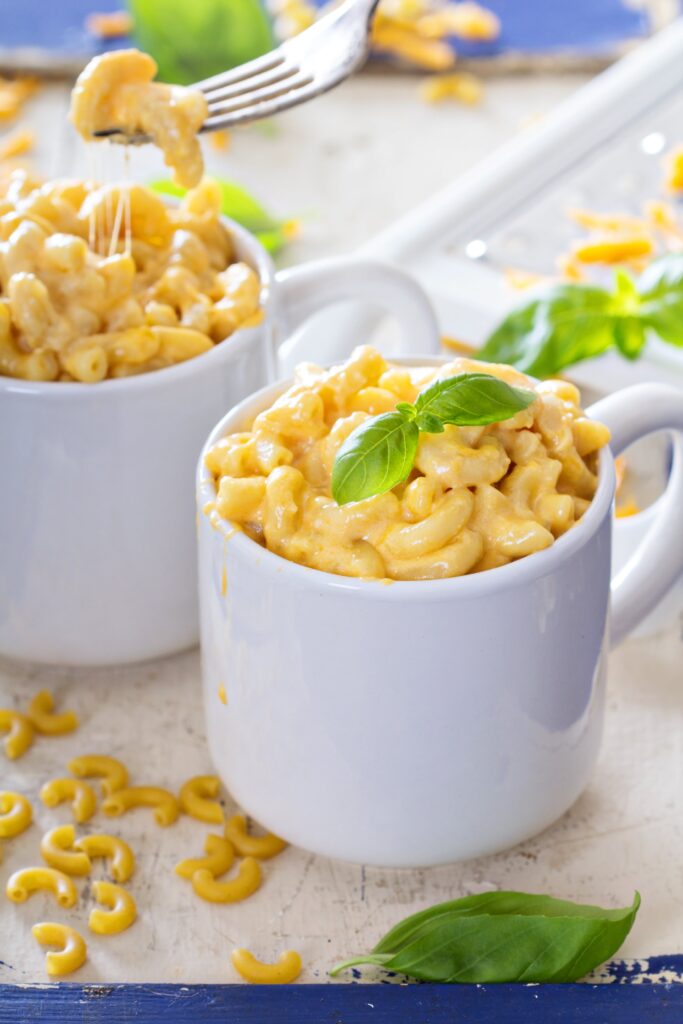 Individual servings of mac and cheese on plates.