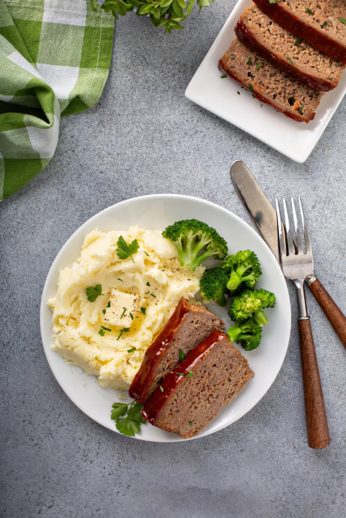 Meatloaf plated with mashed potatoes