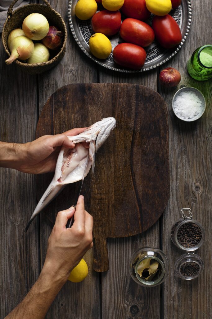 Step-by-step guide to filleting rockfish on a cutting board.