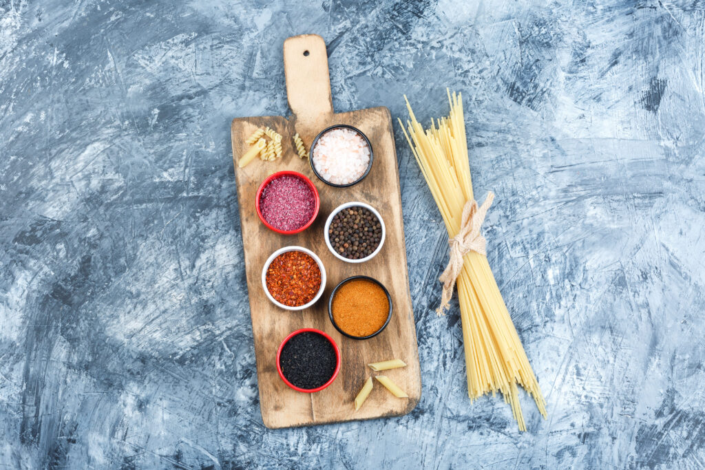 Spices for Alfredo sauce, including black pepper and garlic powder