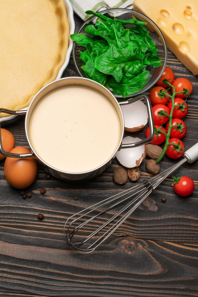 Ingredients for Cajun Alfredo Sauce arranged on a countertop