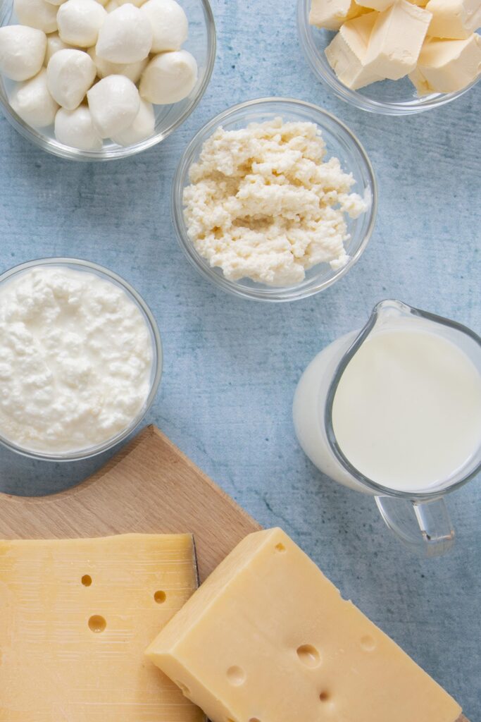 Ingredients for Alfredo sauce including butter, Parmesan cheese, and heavy cream.