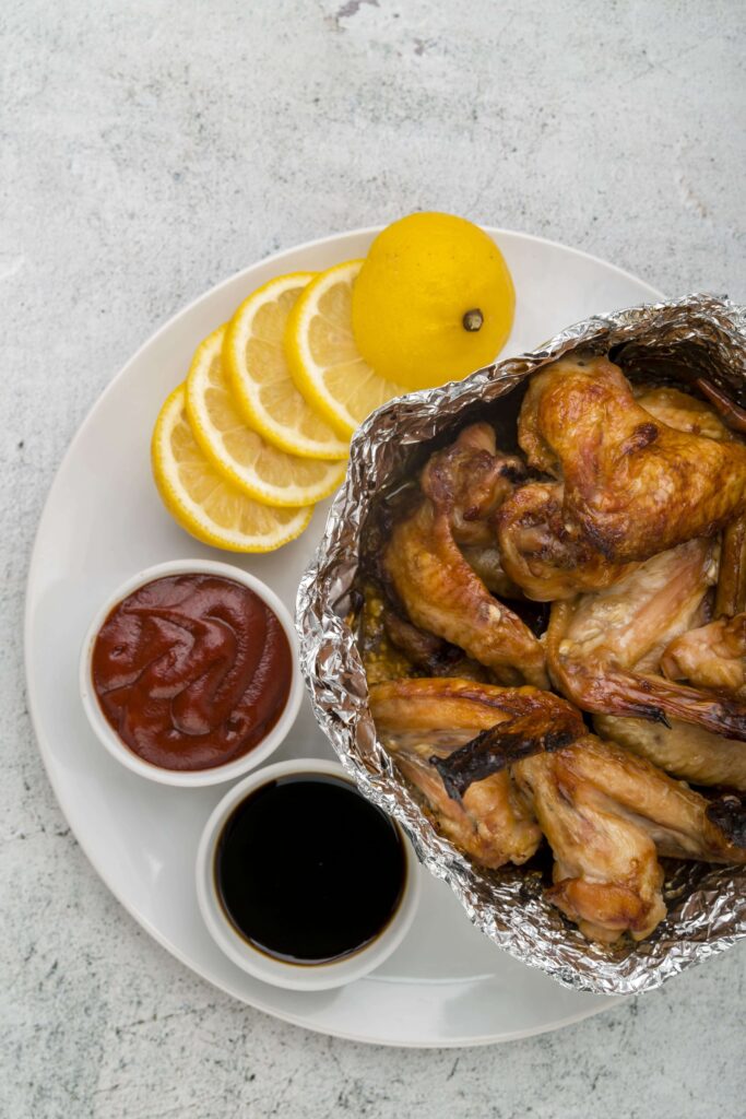 Rotisserie chicken with a smoky barbecue glaze on a serving plate